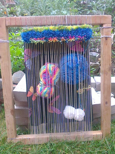 Knotted rug on frame loom with resilience garden behind
